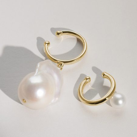 Girl with gold pearl earrings